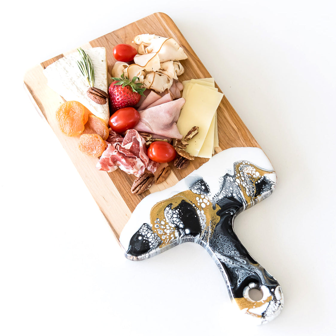 Acacia Resin Cheeseboard with fruit cheese and meat.