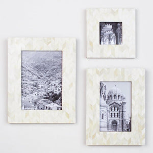 Matr Boomie Artemis style picture frames of various sizes hanging on a wall.