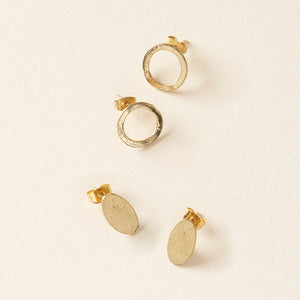Diya style brass stud earrings in Circle and Oval shape, on cream. 