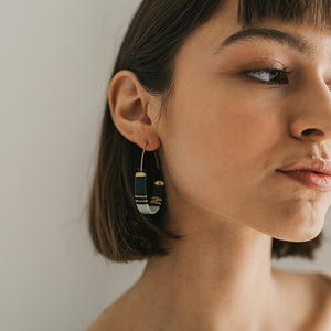 Hoop Earrings with embroidered detail on a stylish woman.