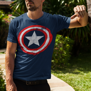 Man wearing Captain America tshirt outside.
